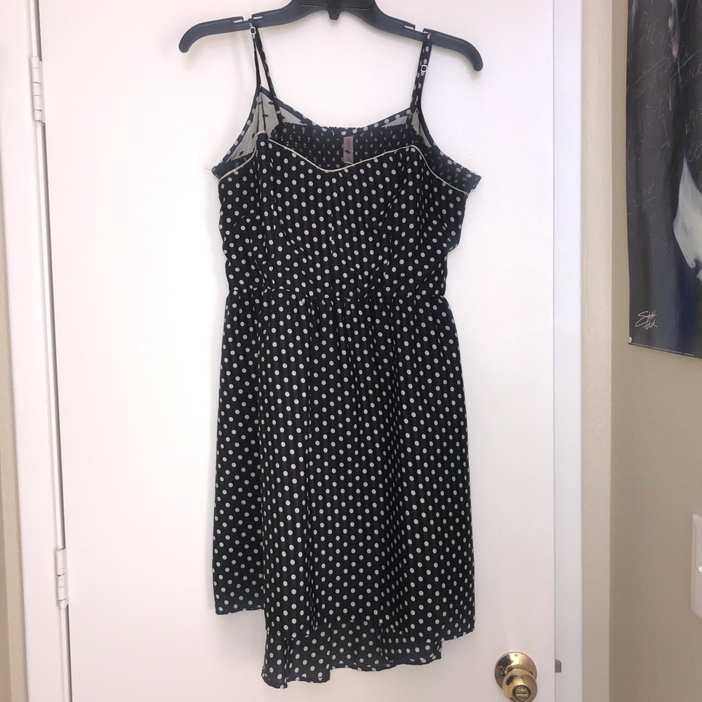 Woman’s black and white polka dot dress